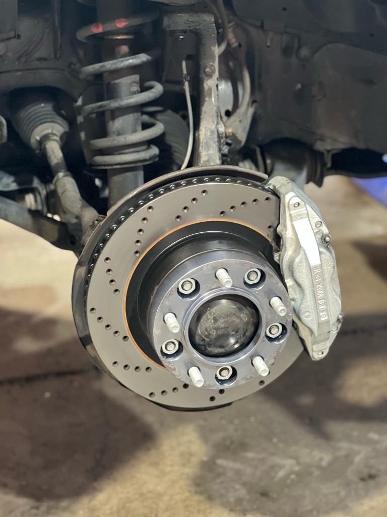 Cross-drilled brake rotor and performance caliper service