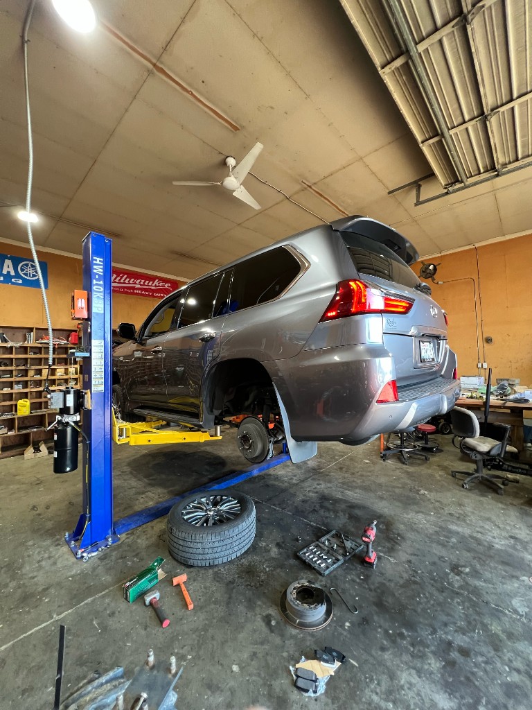 Lexus brake rotor and pad replacement on lift