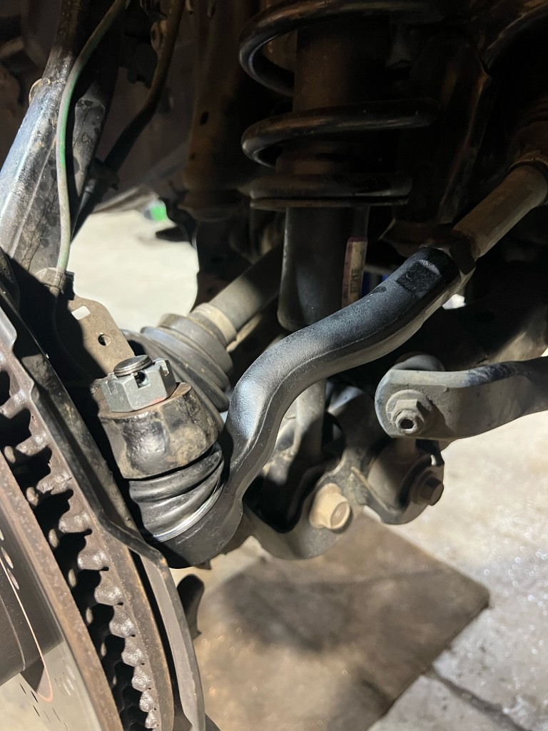 Steering tie rod end replacement on front suspension